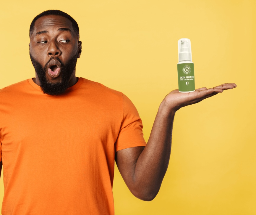 man-holding-skinguard-cream chamois cream
